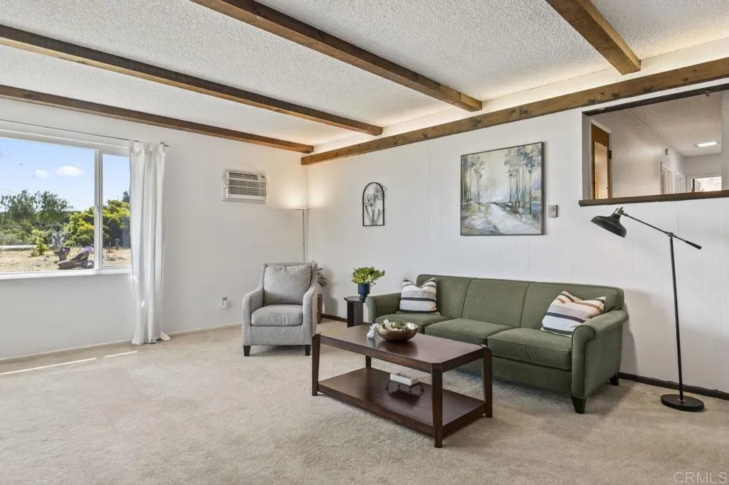 6825 Kellyn Lane Vista, CA 92084 - Photo 11 of 65 a living room with furniture and a window