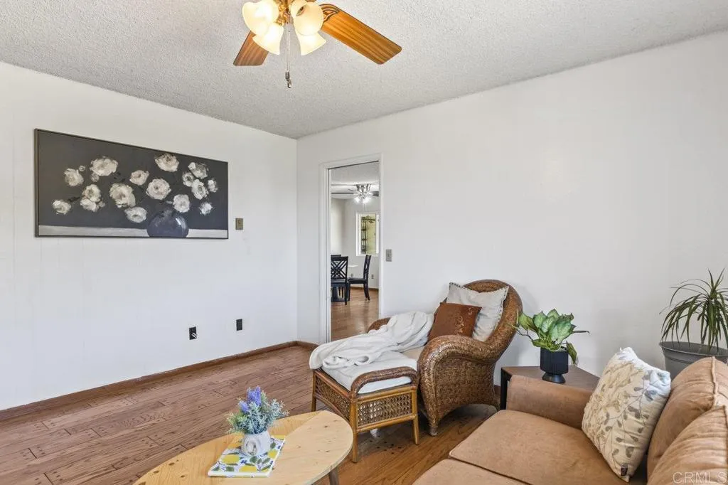 6825 Kellyn Lane Vista, CA 92084 - Photo 16 of 65 a living room with furniture and wooden floor