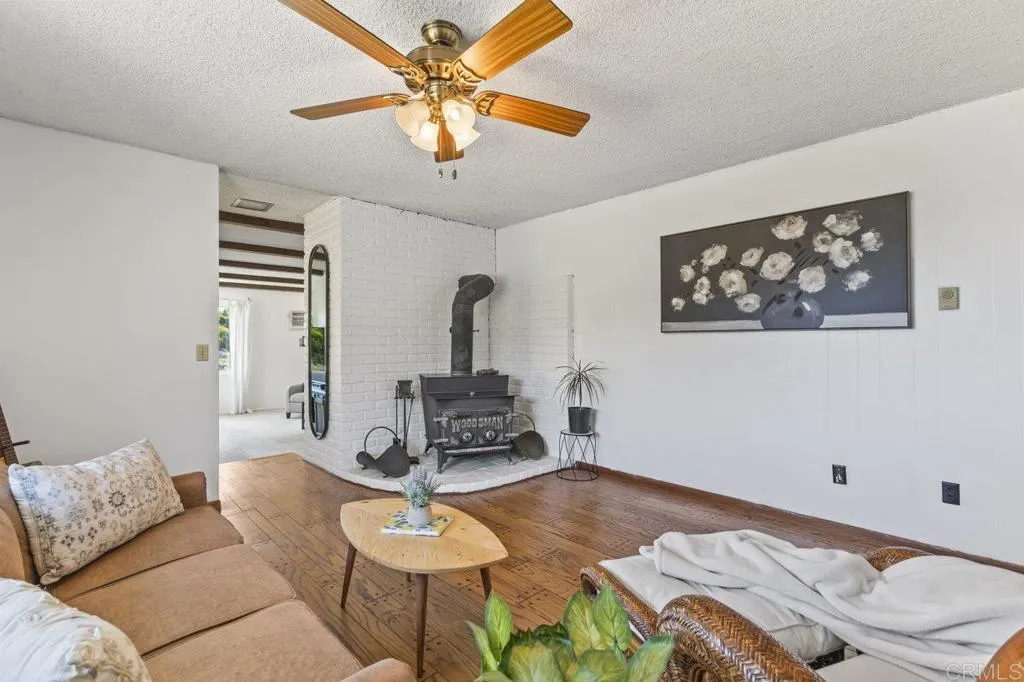6825 Kellyn Lane Vista, CA 92084 - Photo 17 of 65 a living room with furniture and a window