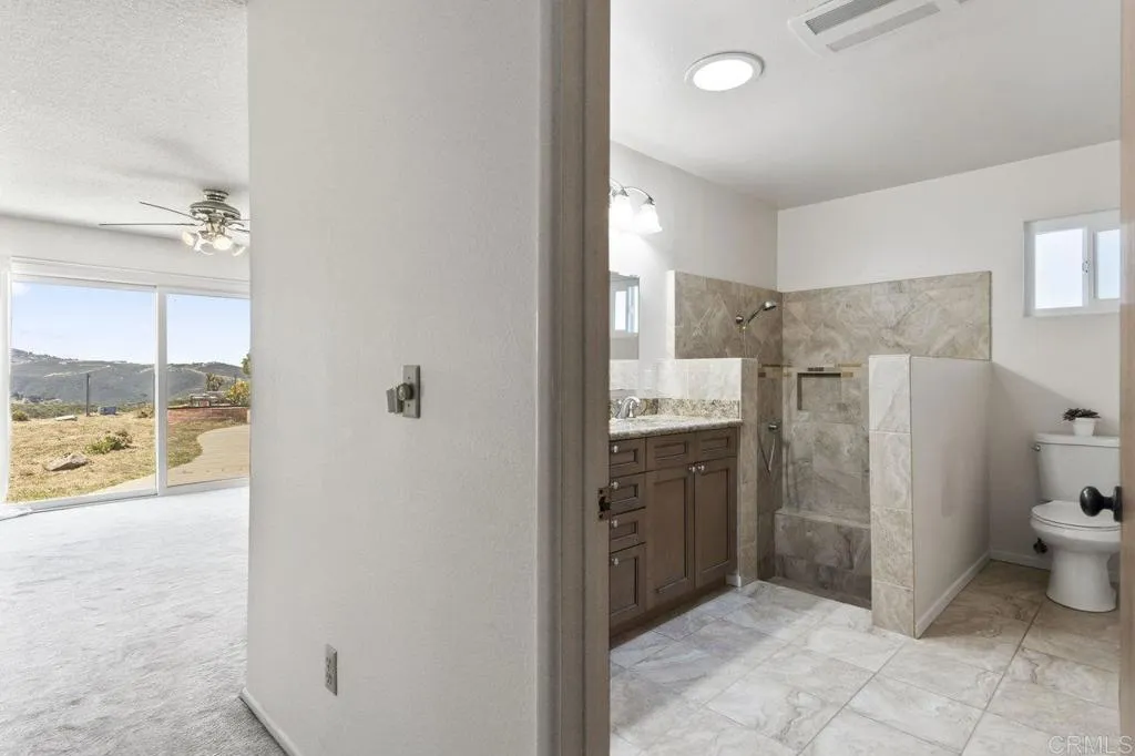 6825 Kellyn Lane Vista, CA 92084 - Photo 29 of 65 a bathroom with a sink toilet and shower