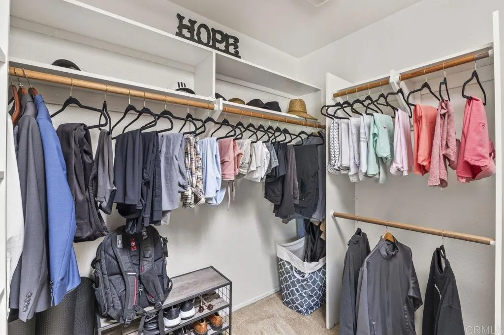 6825 Kellyn Lane Vista, CA 92084 - Photo 33 of 65 a view of walk in closet with clothes and shoes