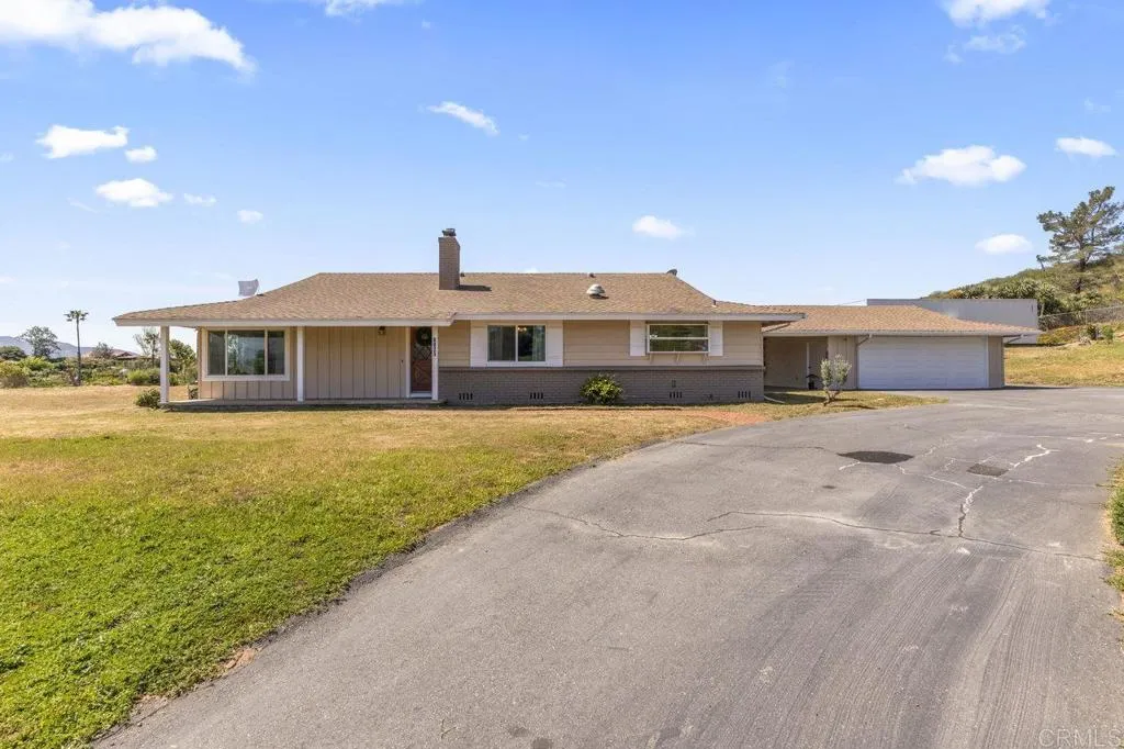 6825 Kellyn Lane Vista, CA 92084 - Photo 4 of 65 a front view of a house with a yard