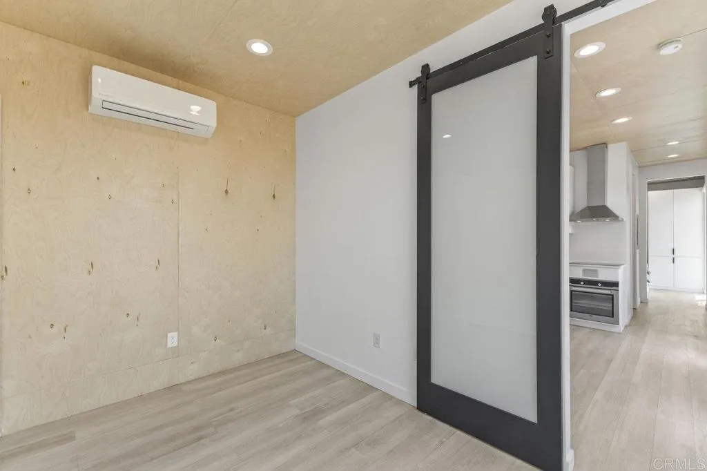 6825 Kellyn Lane Vista, CA 92084 - Photo 48 of 65 a view of a hallway with wooden floor