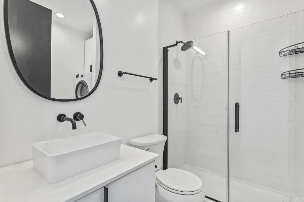 6825 Kellyn Lane Vista, CA 92084 - Photo 50 of 65 a bathroom with a sink toilet and shower