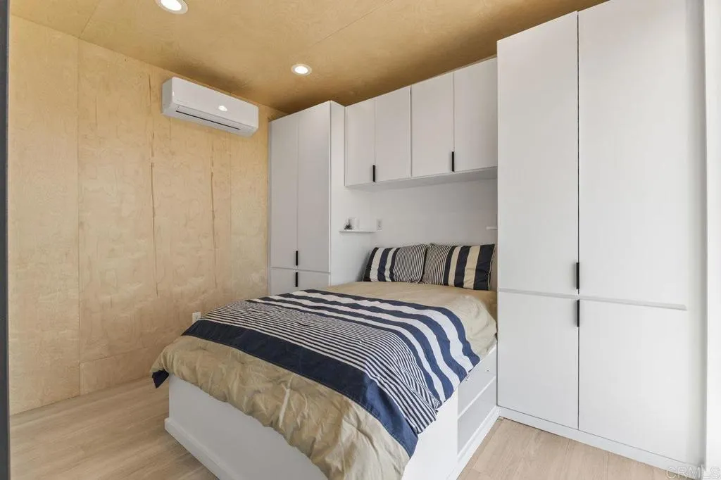 6825 Kellyn Lane Vista, CA 92084 - Photo 51 of 65 a bedroom with a bed and a refrigerator