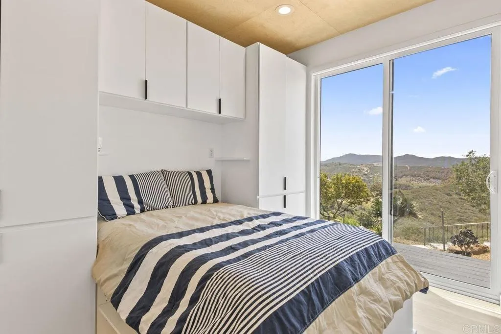 6825 Kellyn Lane Vista, CA 92084 - Photo 52 of 65 a bedroom with a bed and window