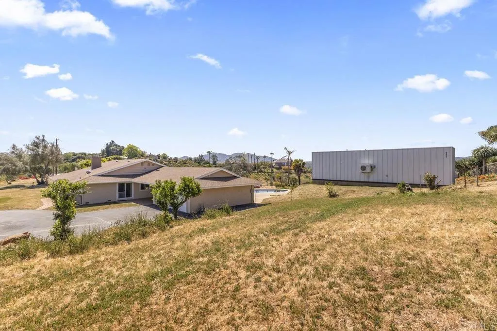 6825 Kellyn Lane Vista, CA 92084 - Photo 8 of 65 a view of a house with a yard and a large window
