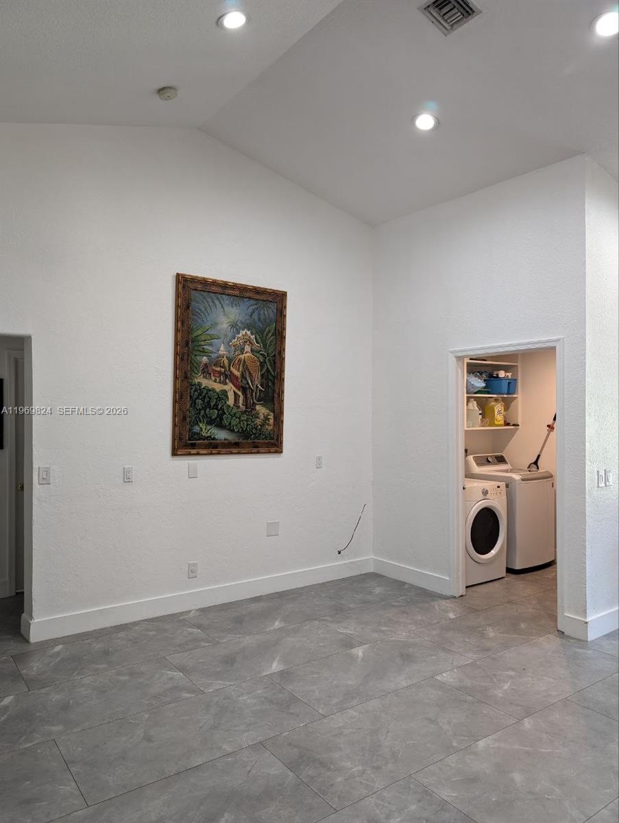 10920 Barn Road Lake Worth, FL 33449 - Photo 11 of 19 an empty room with projector and furniture