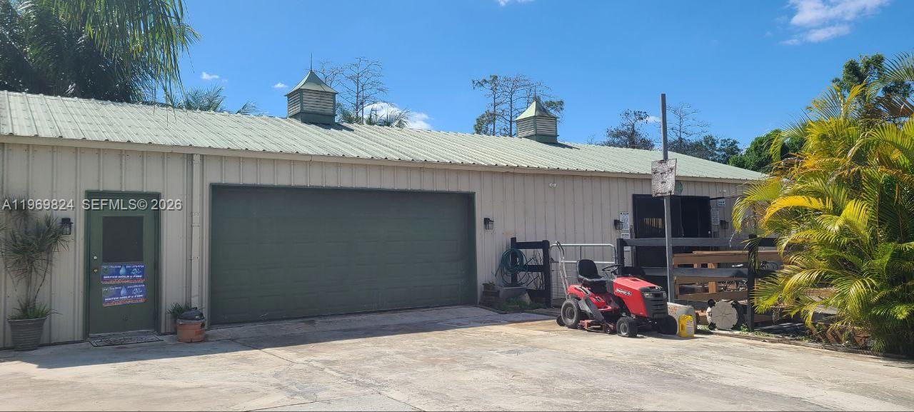 10920 Barn Road Lake Worth, FL 33449 - Photo 3 of 19 a view of a chairs in front of house
