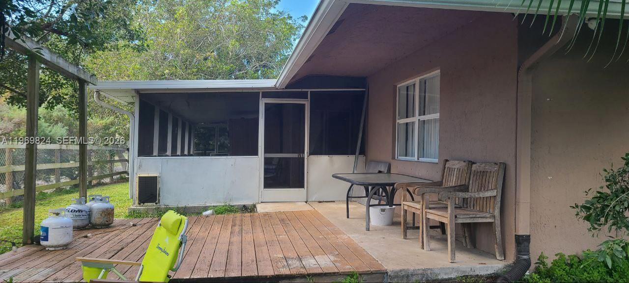 10920 Barn Road Lake Worth, FL 33449 - Photo 8 of 19 a view of backyard with outdoor seating and plants
