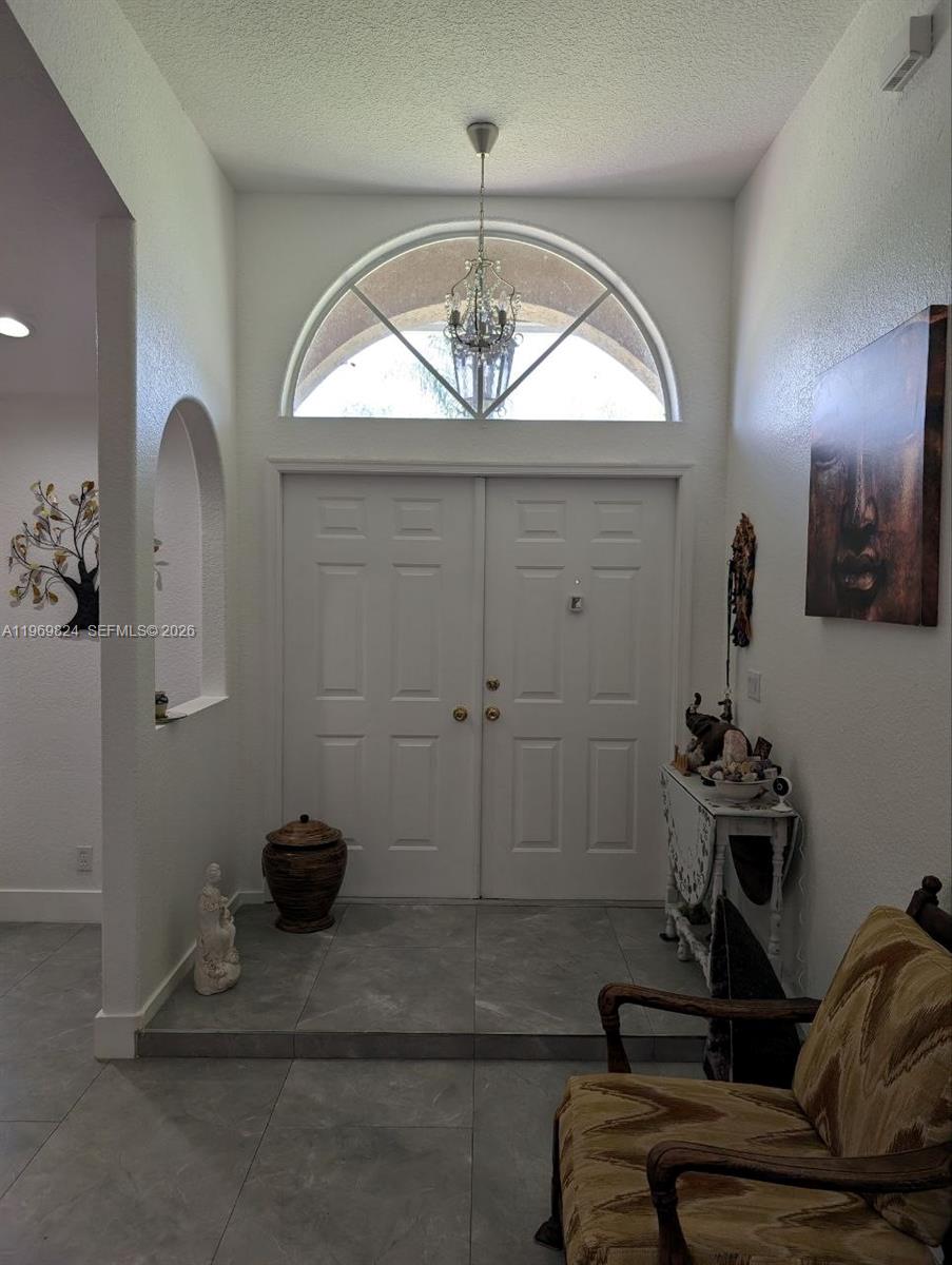 10920 Barn Road Lake Worth, FL 33449 - Photo 9 of 19 a view of a livingroom with furniture and windows