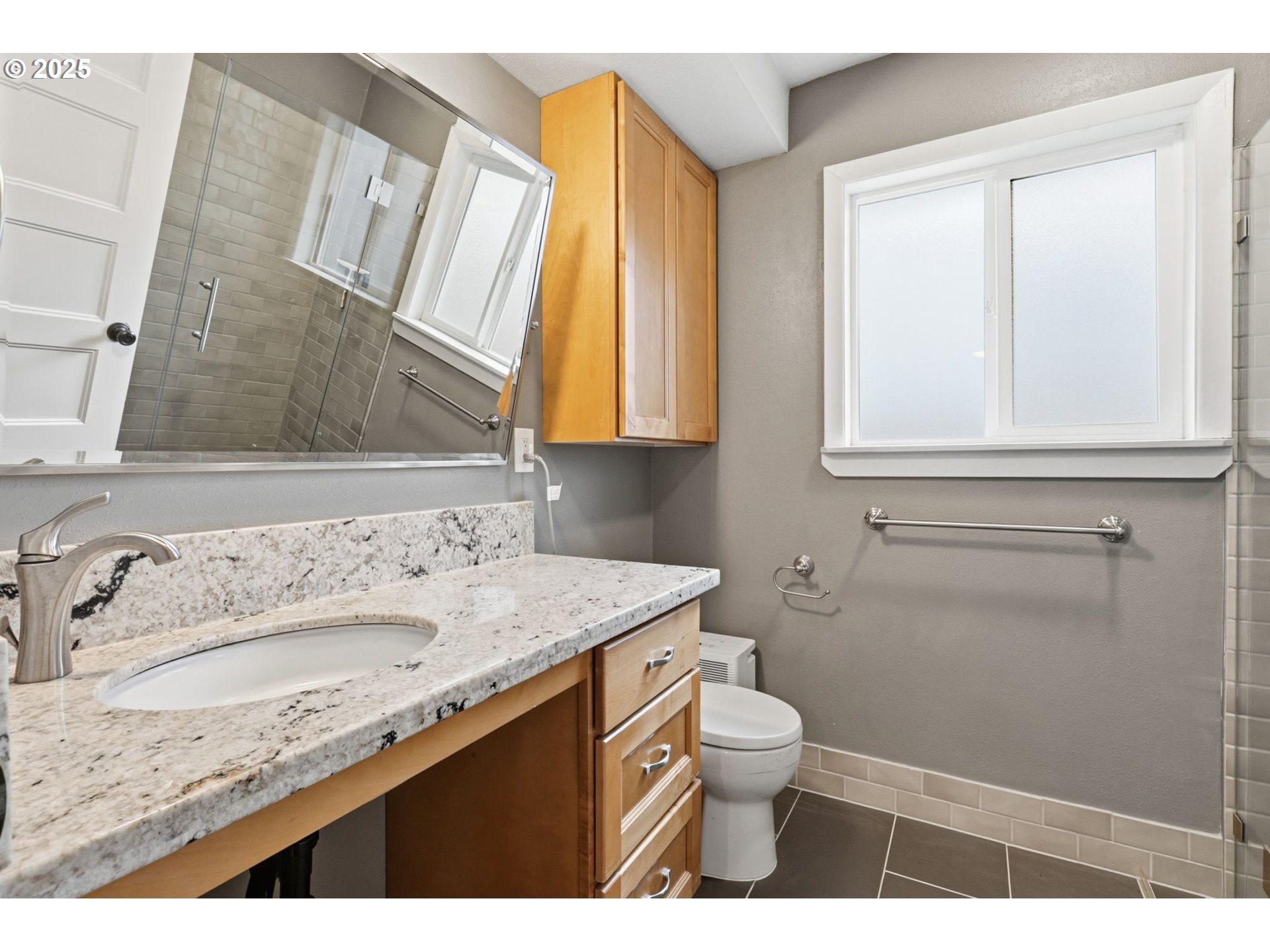 8502 North Hamlin Avenue Portland, OR 97217 - Photo 20 of 48 a bathroom with a granite countertop sink toilet and shower