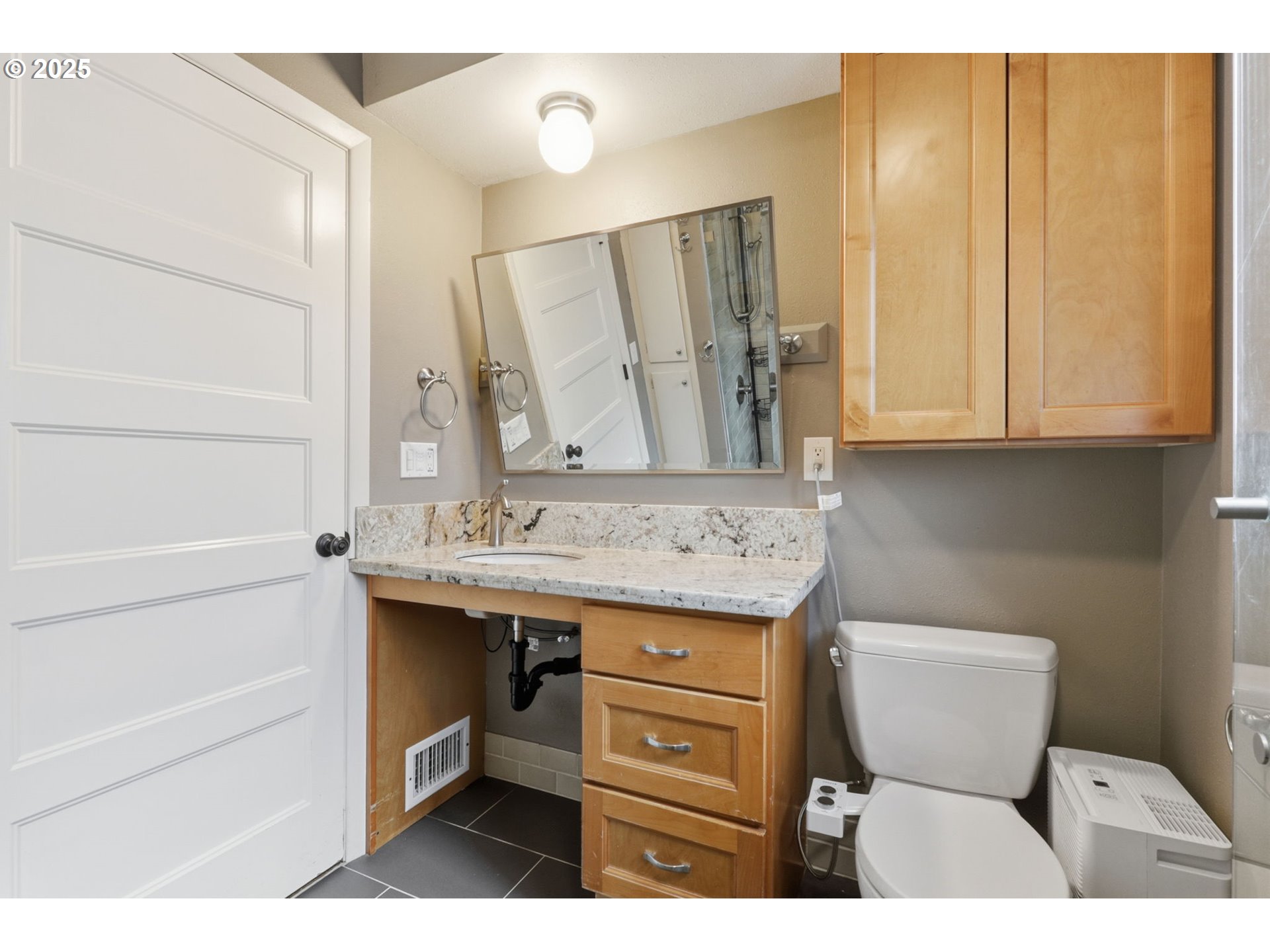 8502 North Hamlin Avenue Portland, OR 97217 - Photo 21 of 48 a bathroom with a sink and a mirror