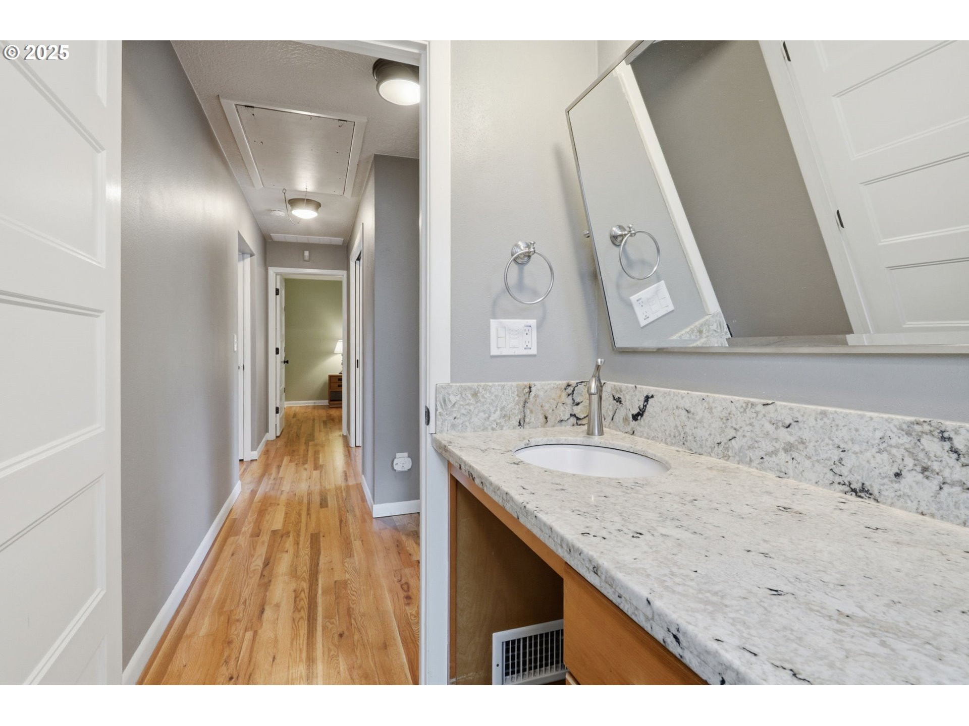 8502 North Hamlin Avenue Portland, OR 97217 - Photo 23 of 48 a bathroom with a sink and a mirror