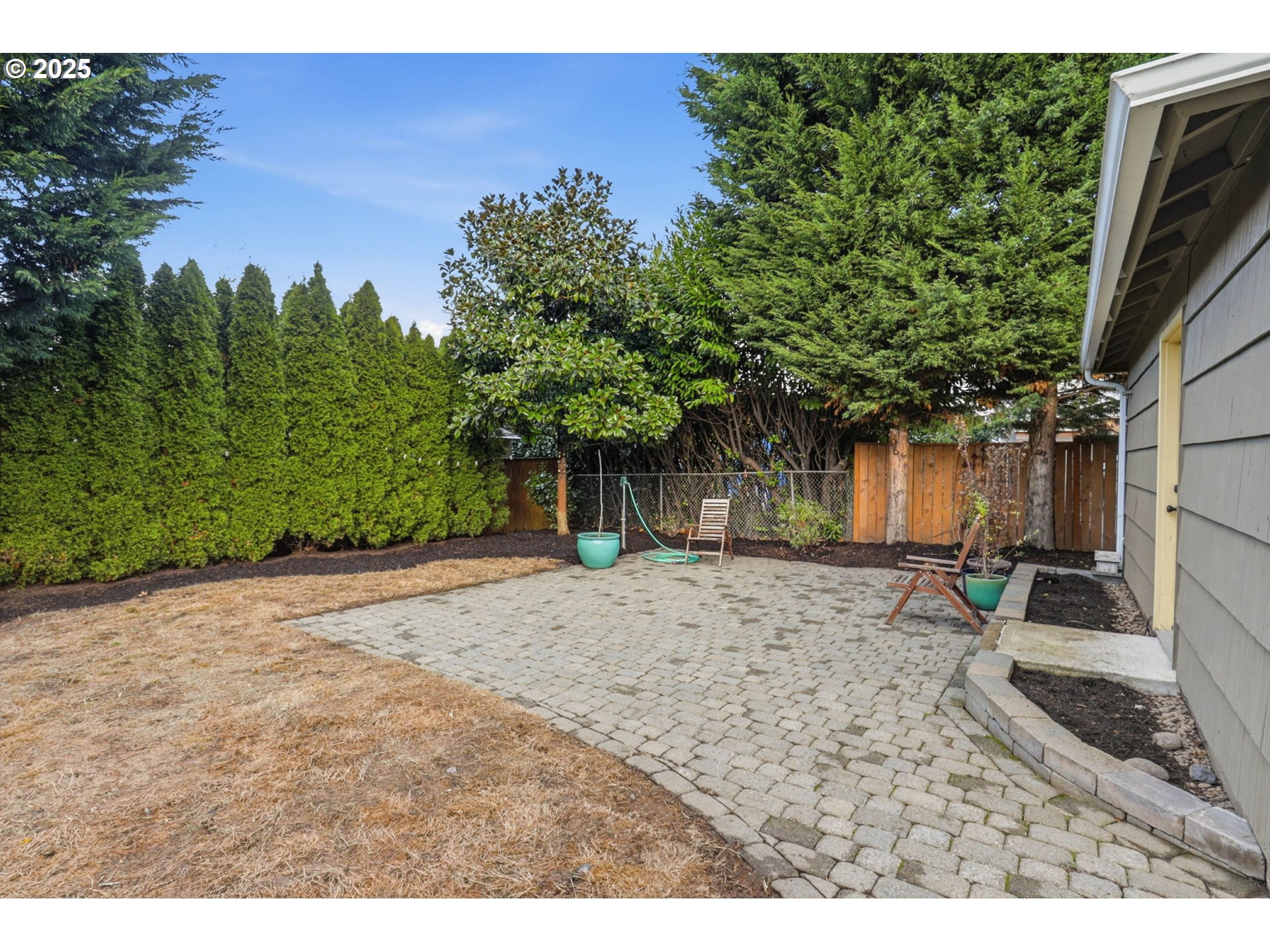 8502 North Hamlin Avenue Portland, OR 97217 - Photo 29 of 48 a view of a backyard with a tree