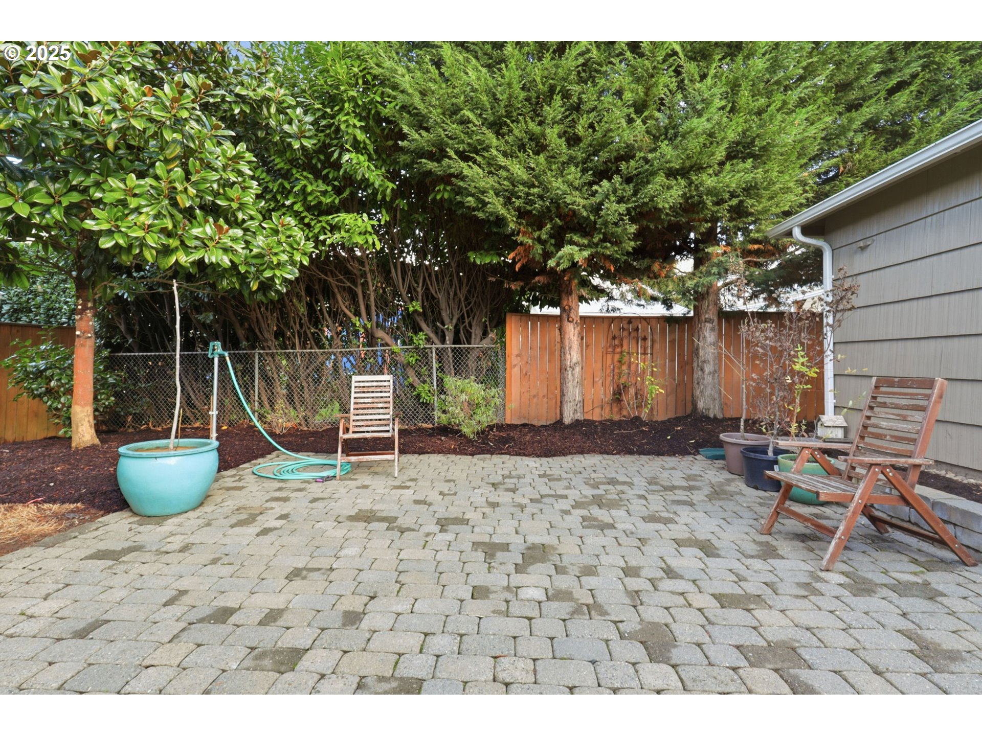 8502 North Hamlin Avenue Portland, OR 97217 - Photo 30 of 48 a backyard of a house with table and chairs