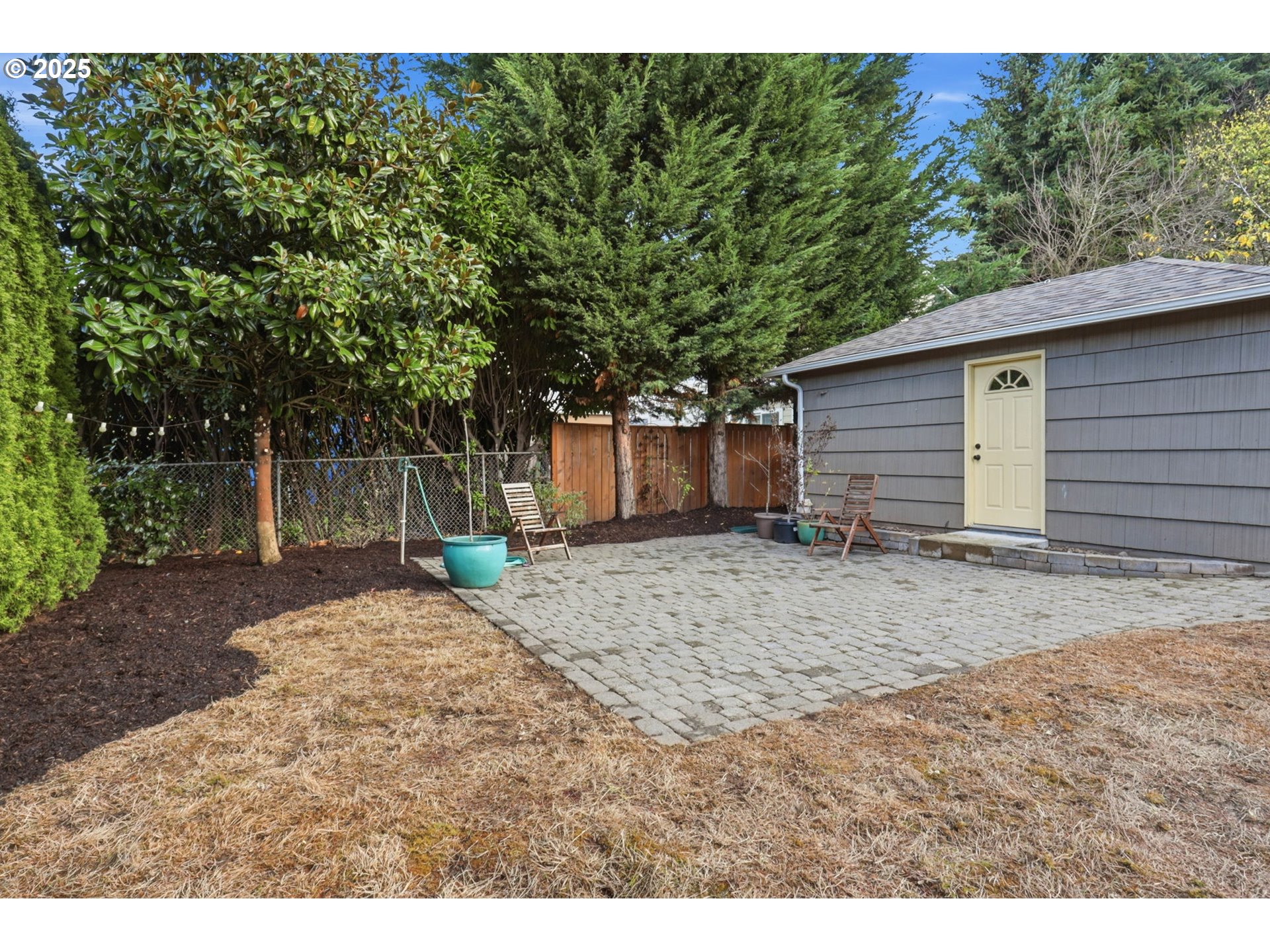 8502 North Hamlin Avenue Portland, OR 97217 - Photo 31 of 48 a backyard of a house with a large tree