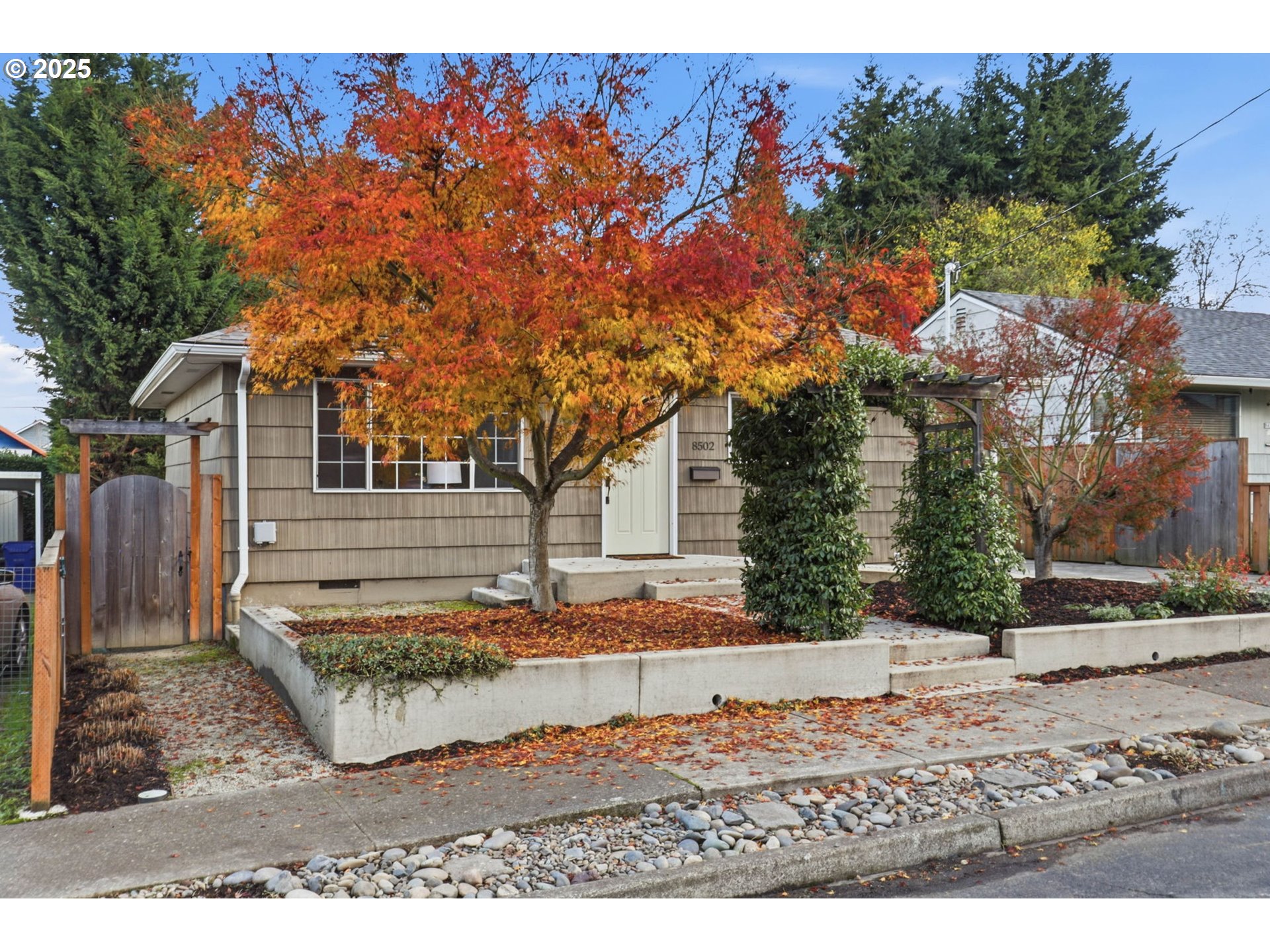 8502 North Hamlin Avenue Portland, OR 97217 - Photo 35 of 48 a view of a backyard with wooden fence