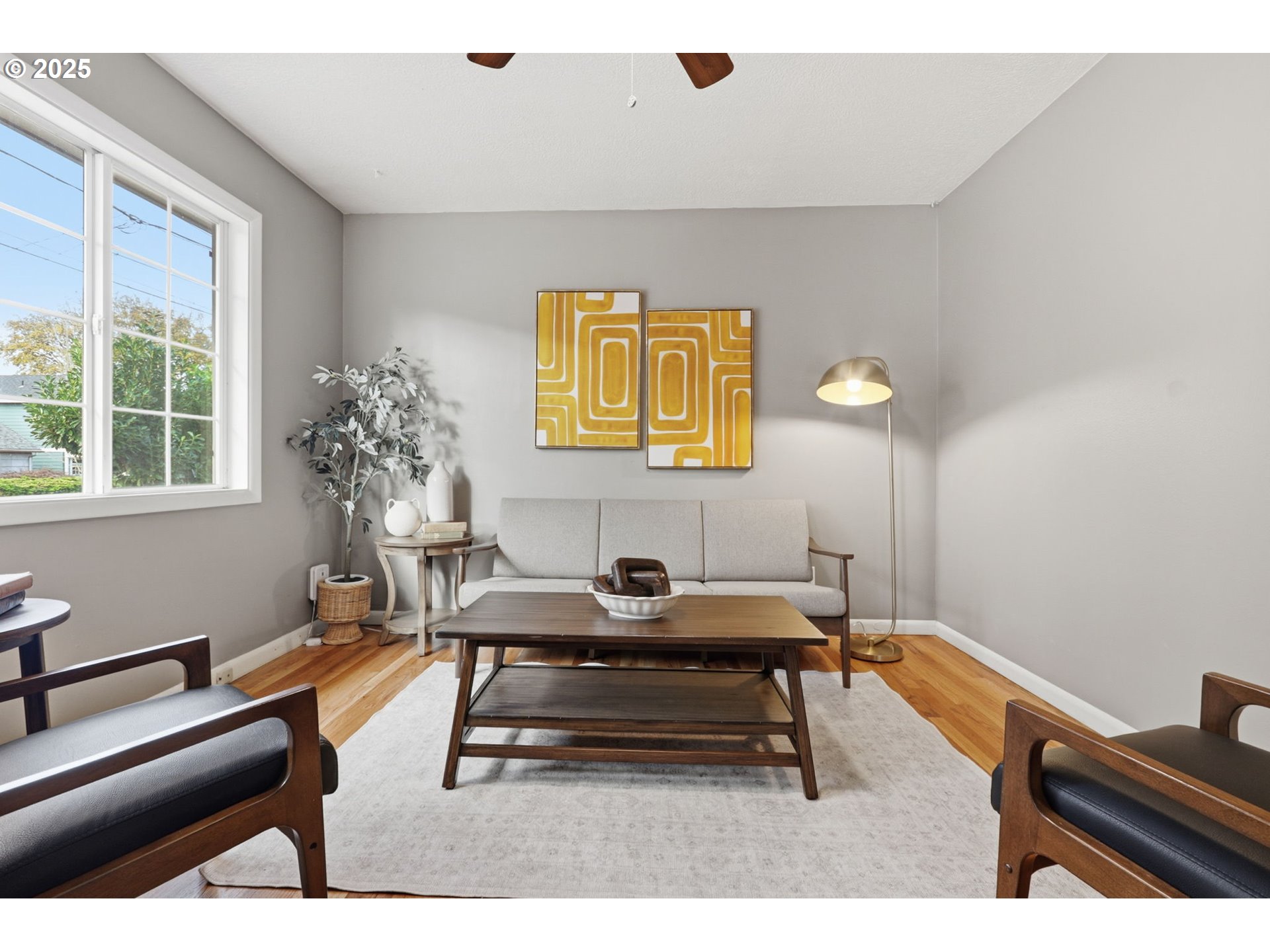 8502 North Hamlin Avenue Portland, OR 97217 - Photo 4 of 48 a living room with furniture and a potted plant