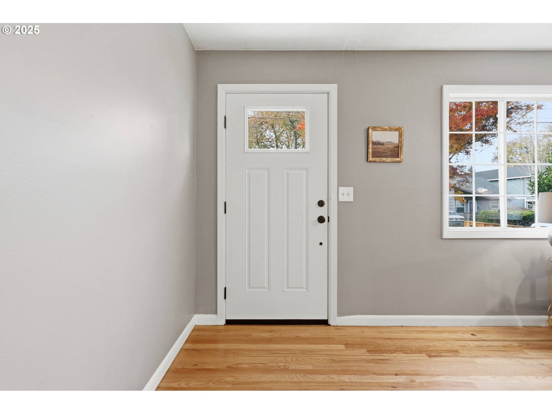 8502 North Hamlin Avenue Portland, OR 97217 - Photo 45 of 48 a view of an empty room with wooden floor and a window