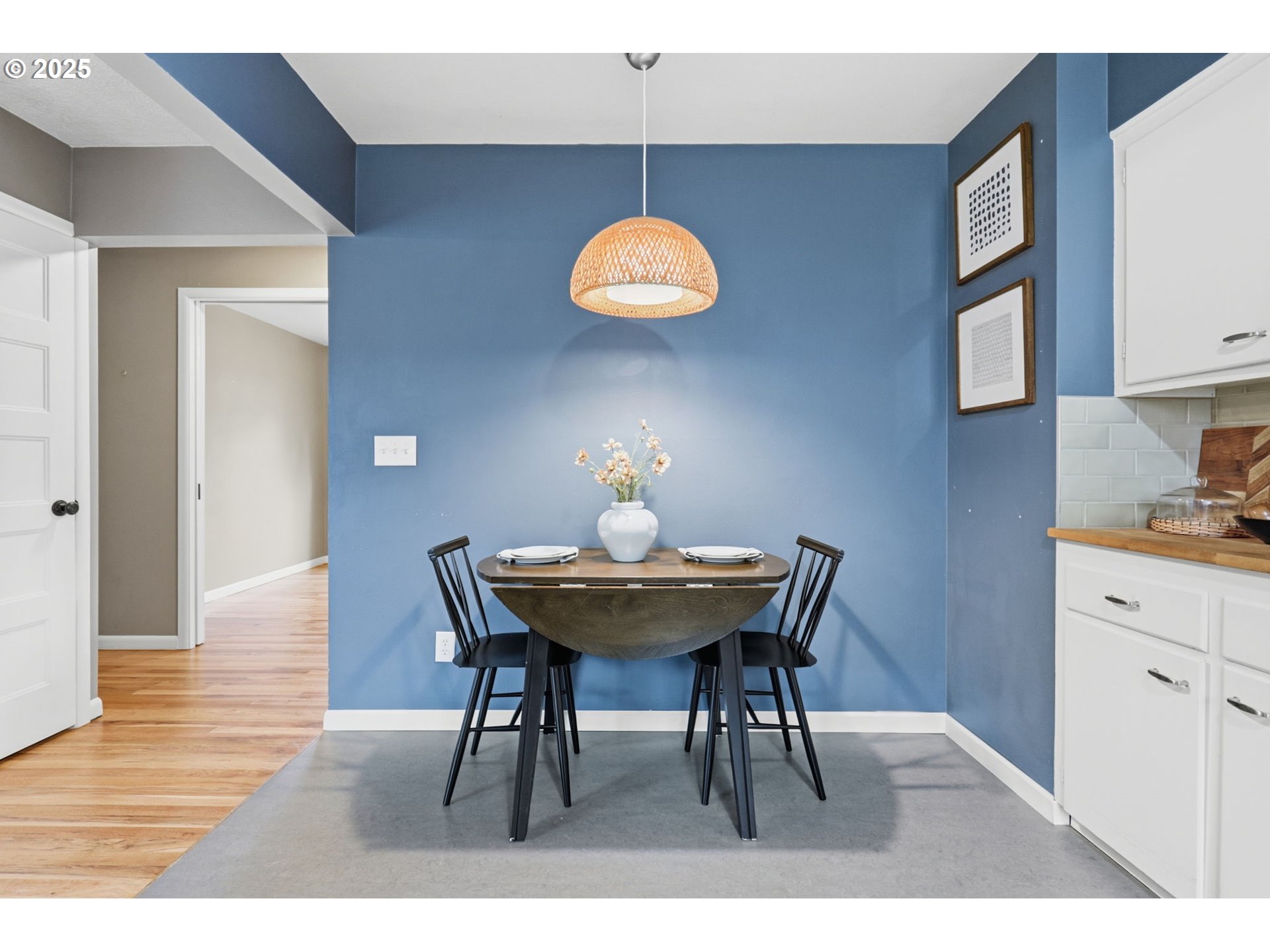 8502 North Hamlin Avenue Portland, OR 97217 - Photo 7 of 48 a view of a dining room with furniture and wooden floor