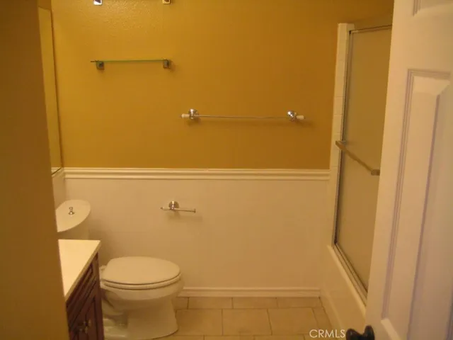 a bathroom with a shower and a toilet