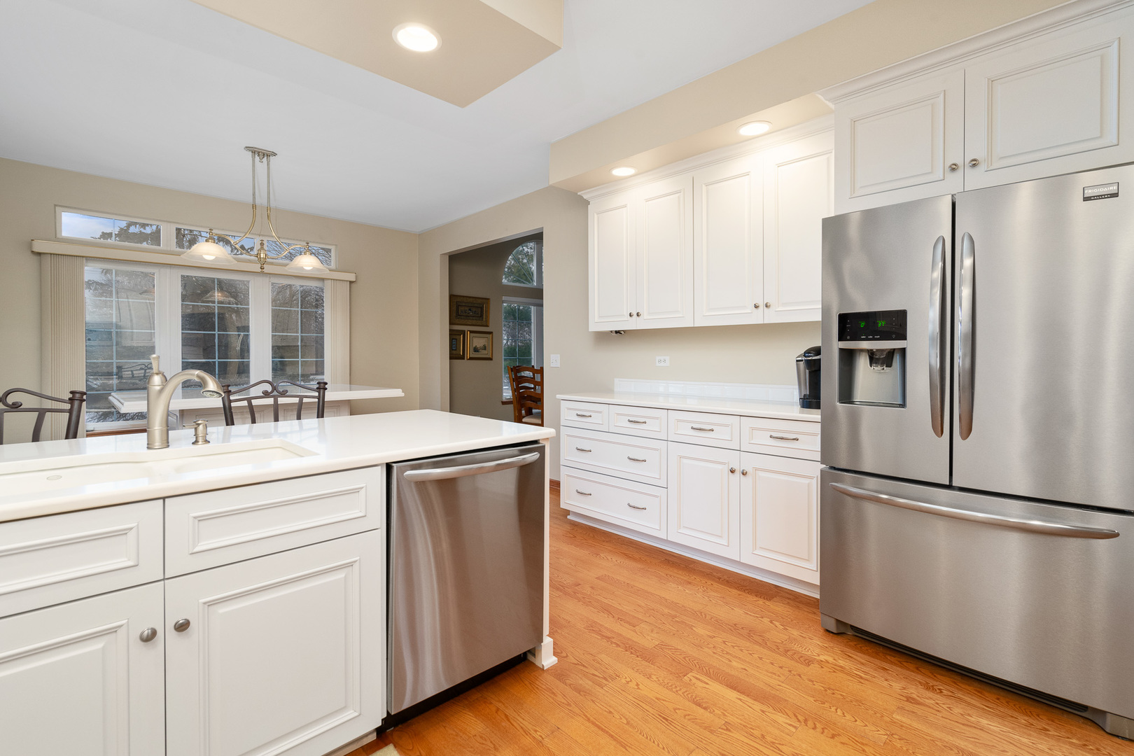 16551 SpringView Drive Lockport, IL 60441 - Photo 7 of 47 a kitchen with kitchen island white cabinets and stainless steel appliances