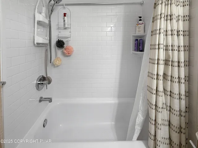 a bathroom with a sink mirror and vanity