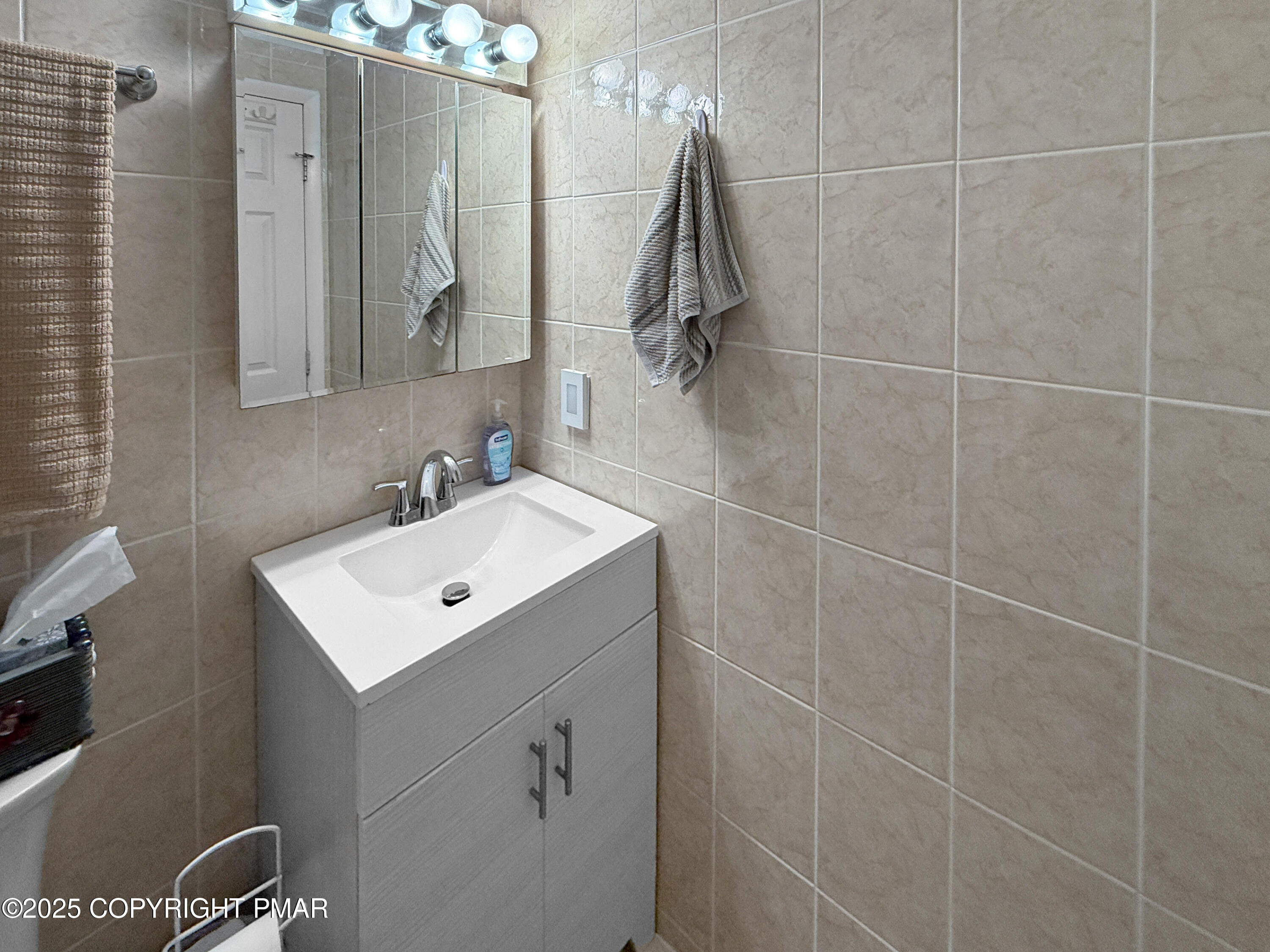 274 Nittany Court Mount Pocono, PA 18344 - Photo 20 of 28 a bathroom with a sink mirror and vanity