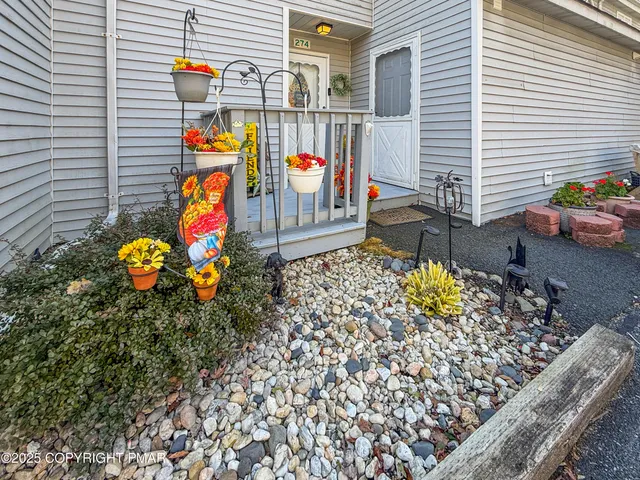 a view of a house with a chairs in patio