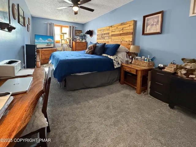 a bedroom with furniture and a window