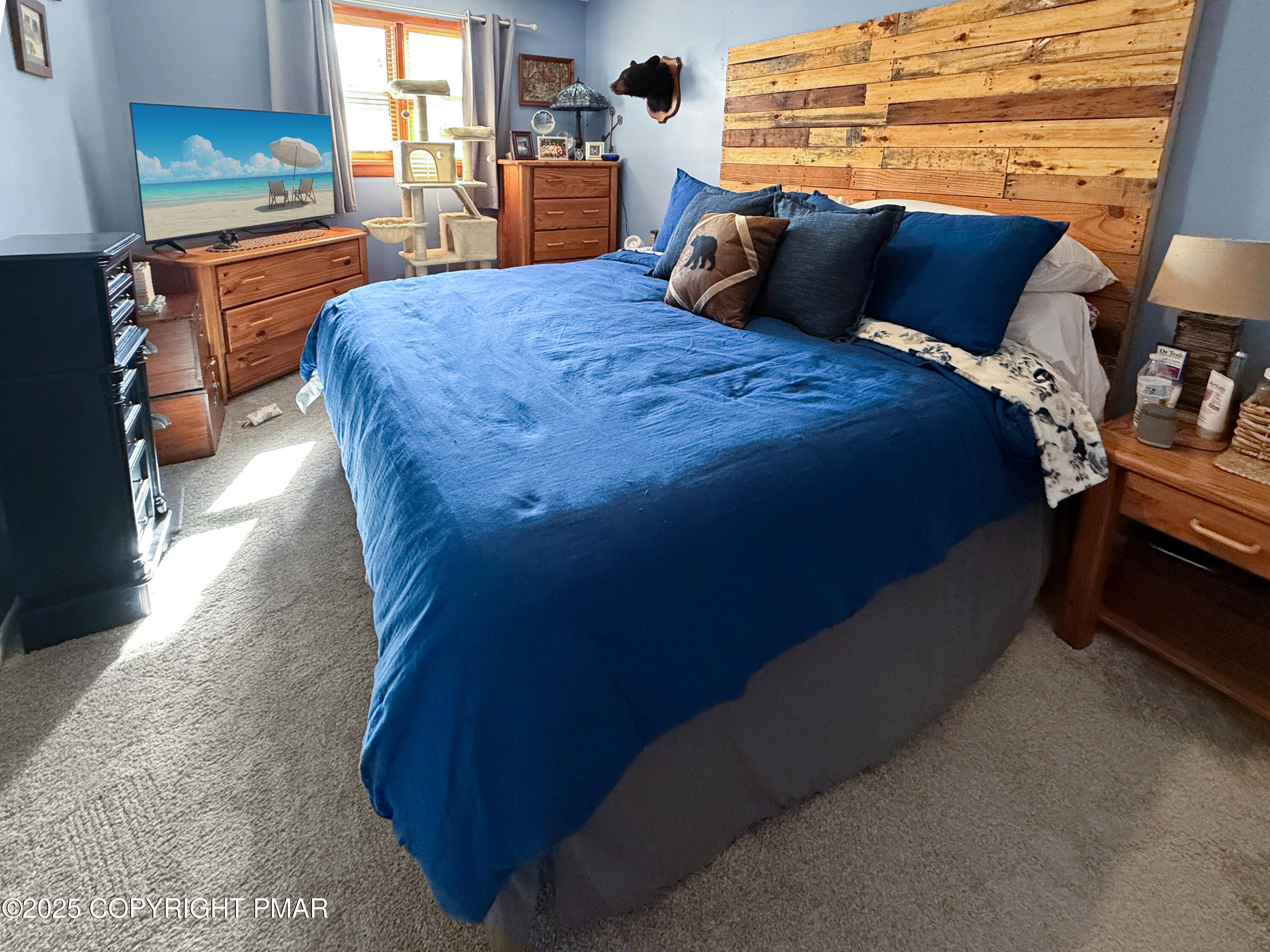 274 Nittany Court Mount Pocono, PA 18344 - Photo 22 of 28 a bed sitting in a bedroom next to a larger window