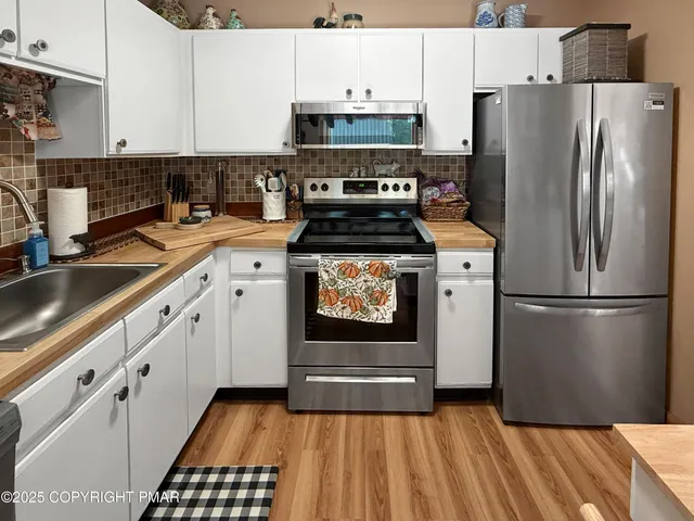 a dining room with furniture and chandelier