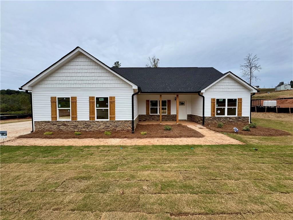 a front view of a house with a yard