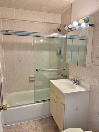 a bathroom with a bathtub and a sink