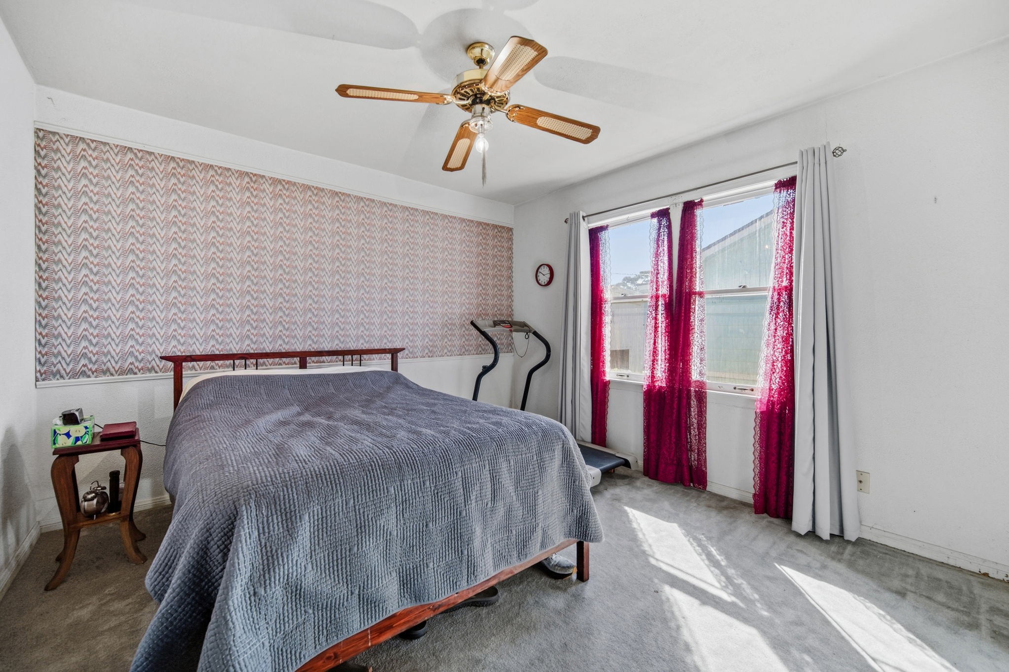 1604 Kipling Street Liberty, TX 77575 - Photo 13 of 19 a bed room with a bed and a chandelier