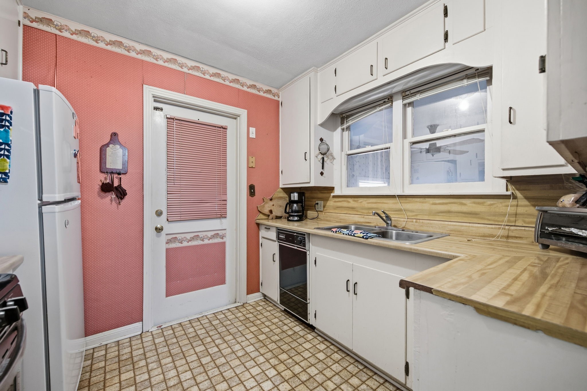 1604 Kipling Street Liberty, TX 77575 - Photo 8 of 19 a kitchen with a sink stove and refrigerator