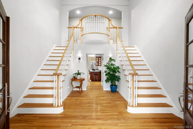 a view of an entryway with wooden floor