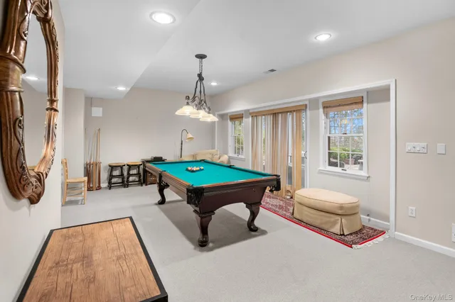 a view of a bench in the patio next to a yard