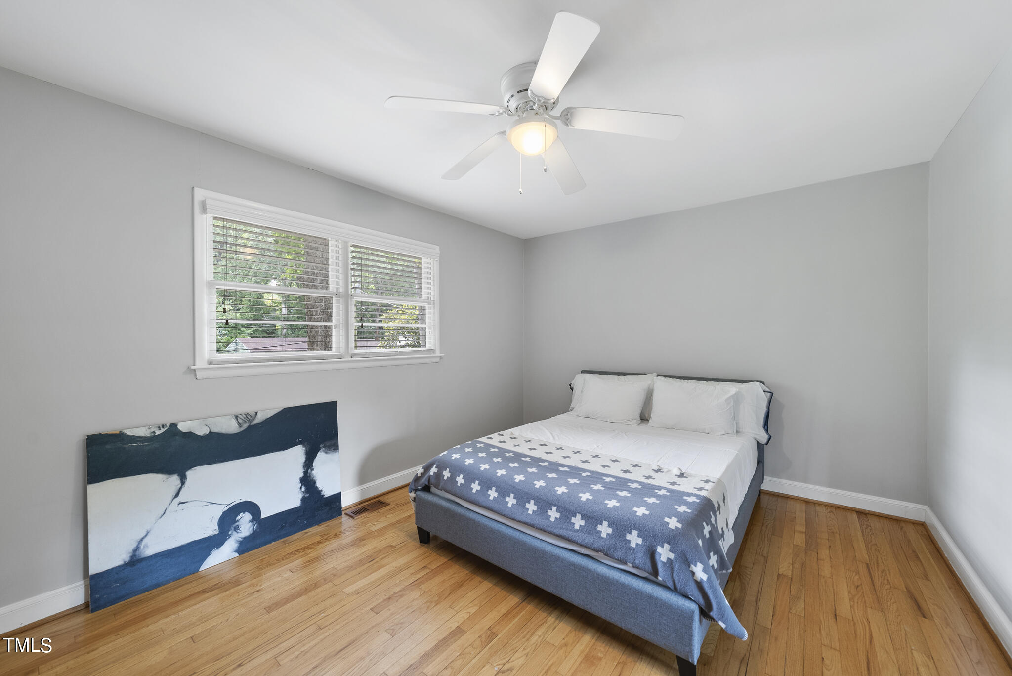 819 Beaver Dam Road Raleigh, NC 27607 - Photo 16 of 28 a bedroom with a bed and a desk