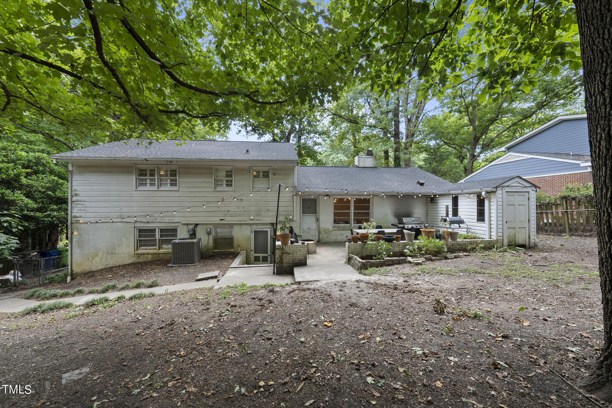 819 Beaver Dam Road Raleigh, NC 27607 - Photo 24 of 28 a view of a house with a yard and large trees