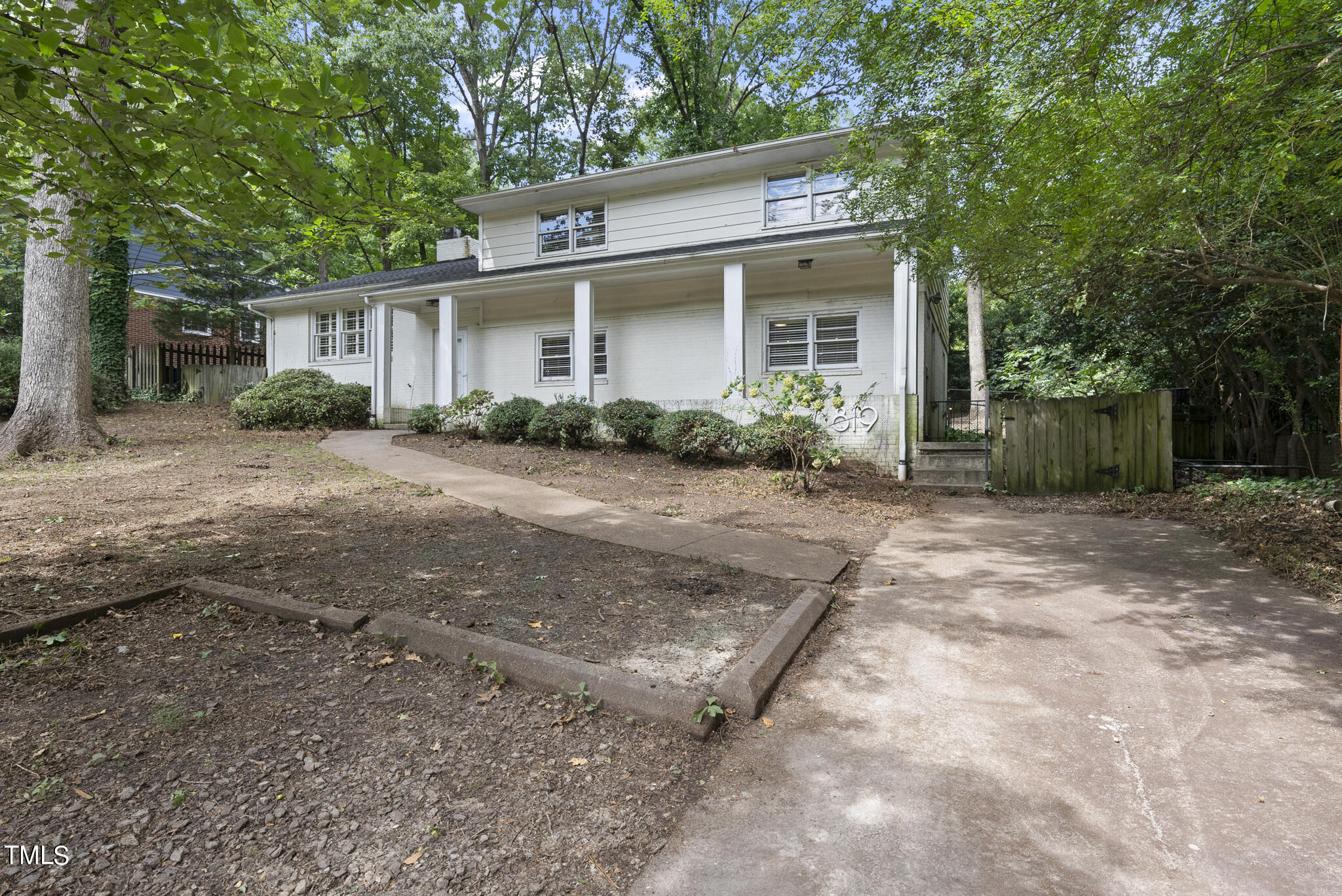 819 Beaver Dam Road Raleigh, NC 27607 - Photo 27 of 28 a view of a house with a backyard