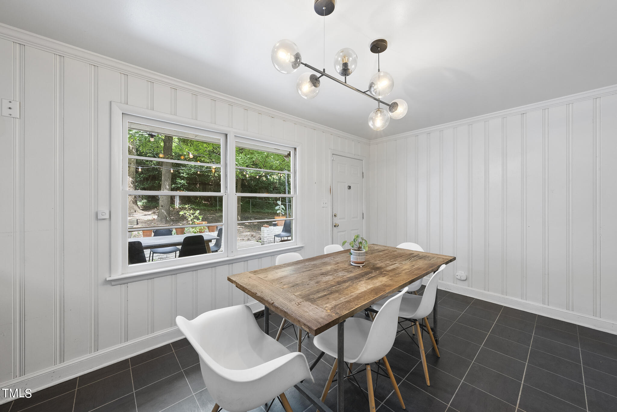 819 Beaver Dam Road Raleigh, NC 27607 - Photo 5 of 28 a view of a dining room with furniture window and outside view