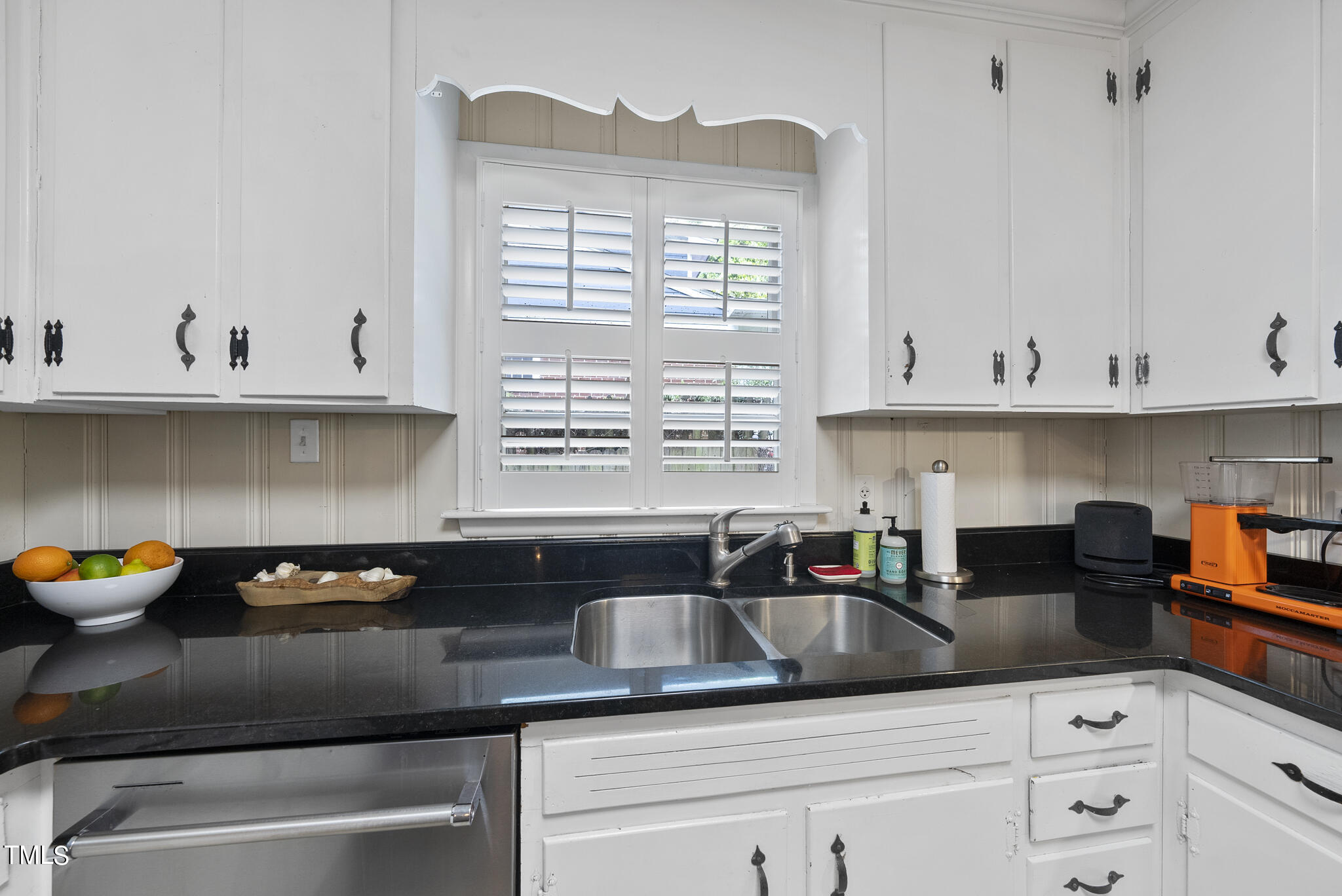 819 Beaver Dam Road Raleigh, NC 27607 - Photo 8 of 28 a kitchen with stainless steel appliances granite countertop a sink a stove and a granite counter tops