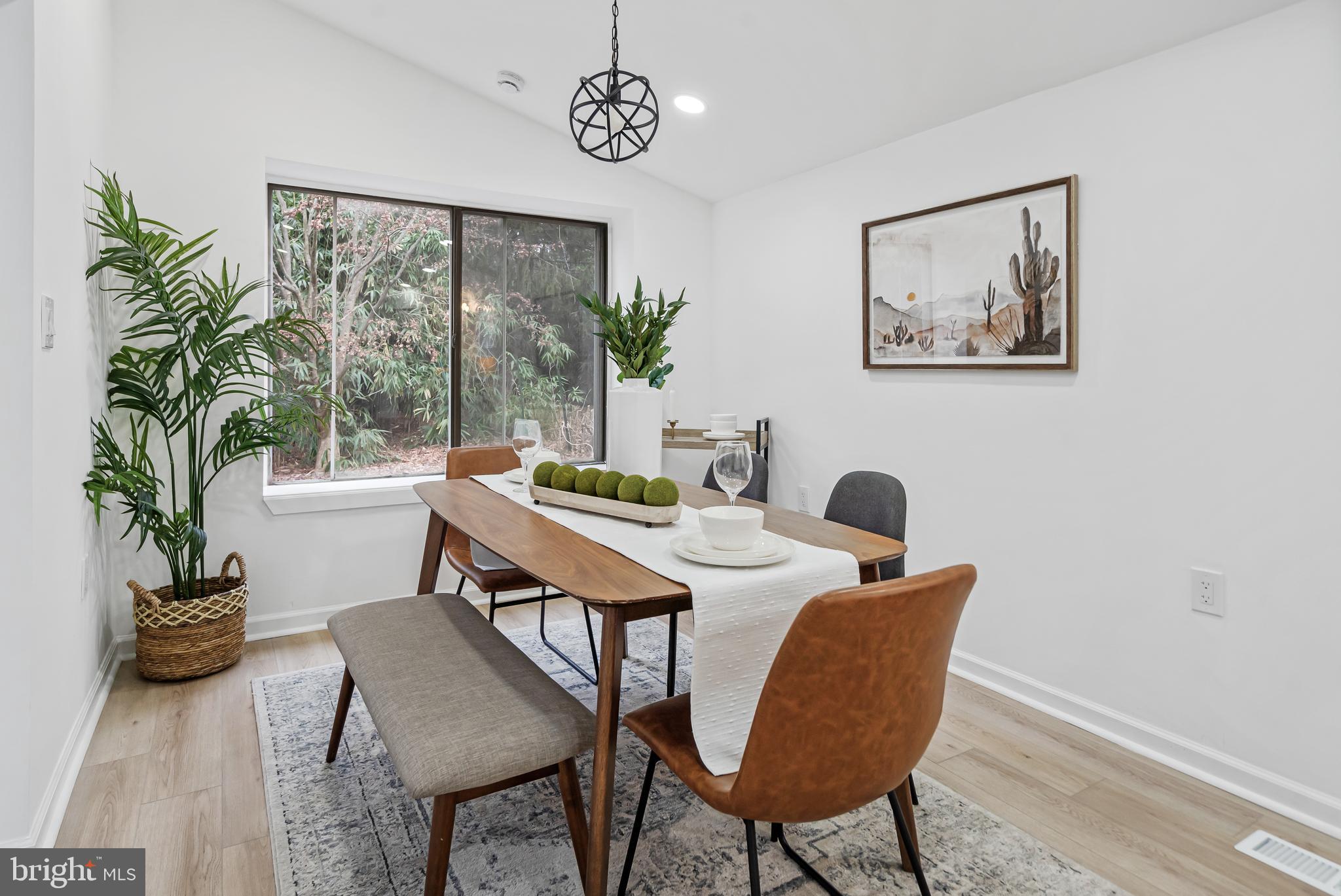 6136 Sinbad Place Columbia, MD 21045 - Photo 13 of 31 a view of a dining room with furniture window and wooden floor