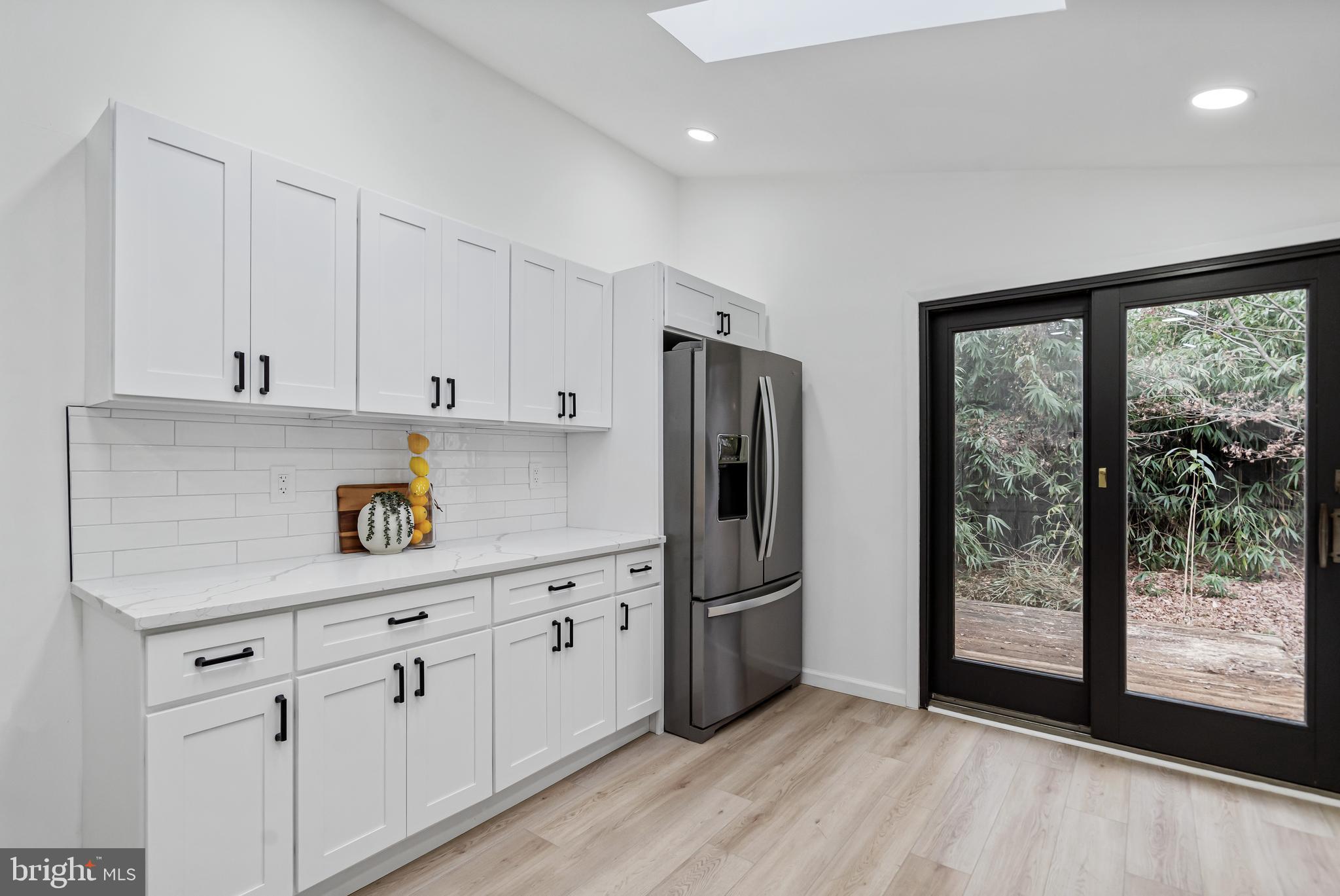 6136 Sinbad Place Columbia, MD 21045 - Photo 18 of 31 a kitchen with stainless steel appliances a refrigerator sink and cabinets
