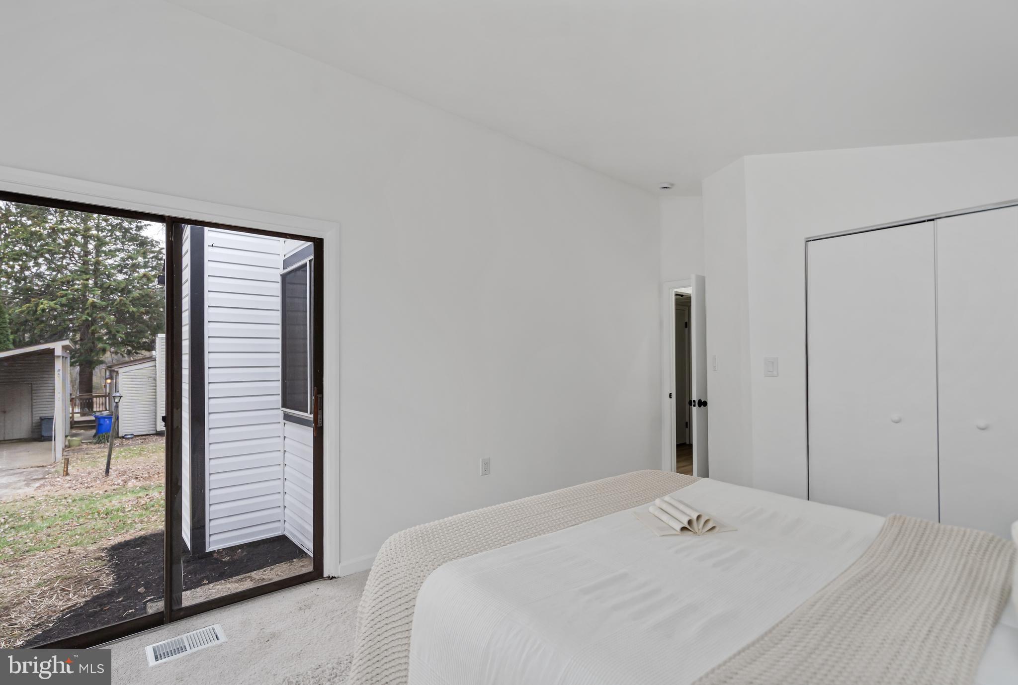 6136 Sinbad Place Columbia, MD 21045 - Photo 27 of 31 a bedroom with a bed and a large window