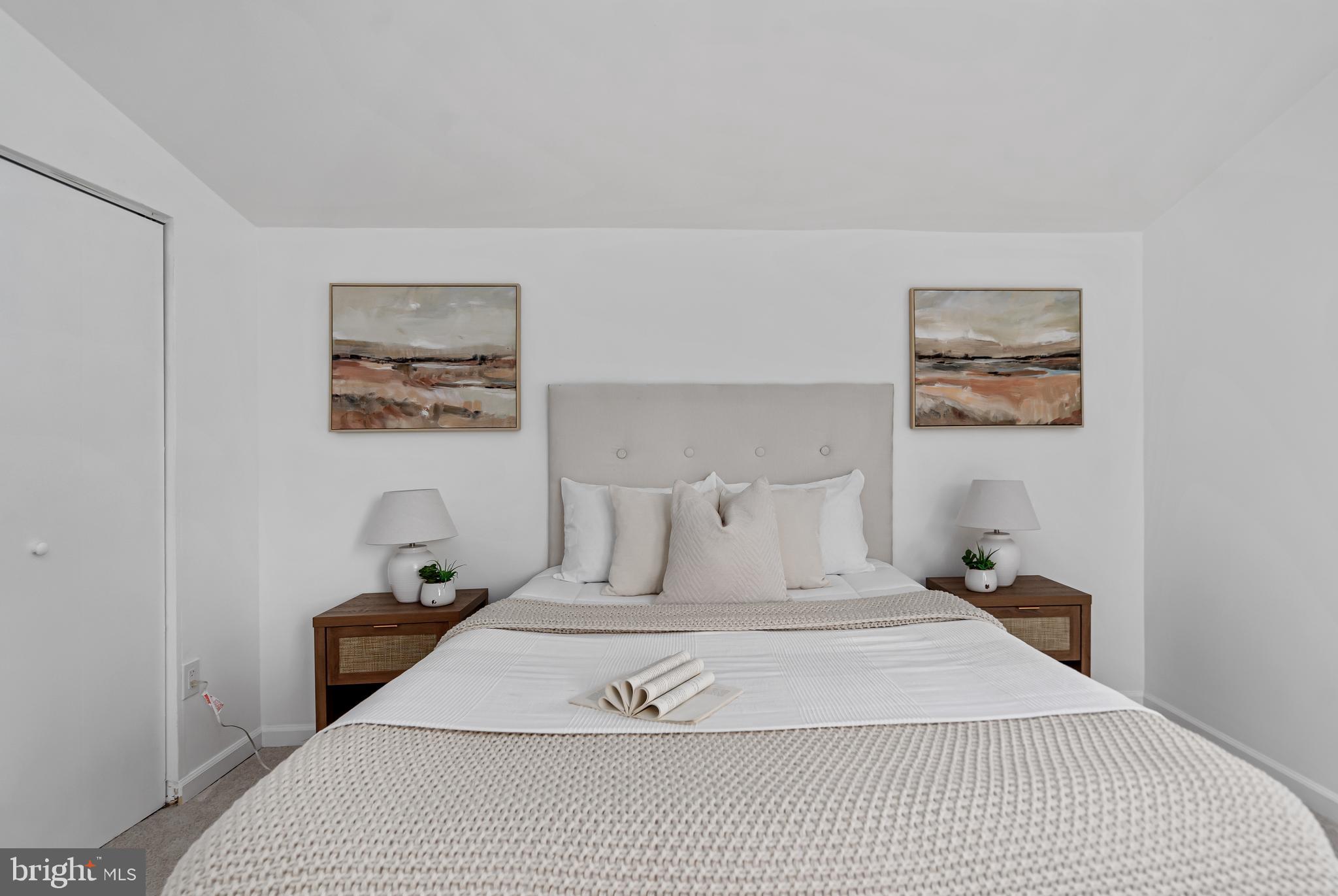 6136 Sinbad Place Columbia, MD 21045 - Photo 28 of 31 a bedroom with a bed and painting on the wall