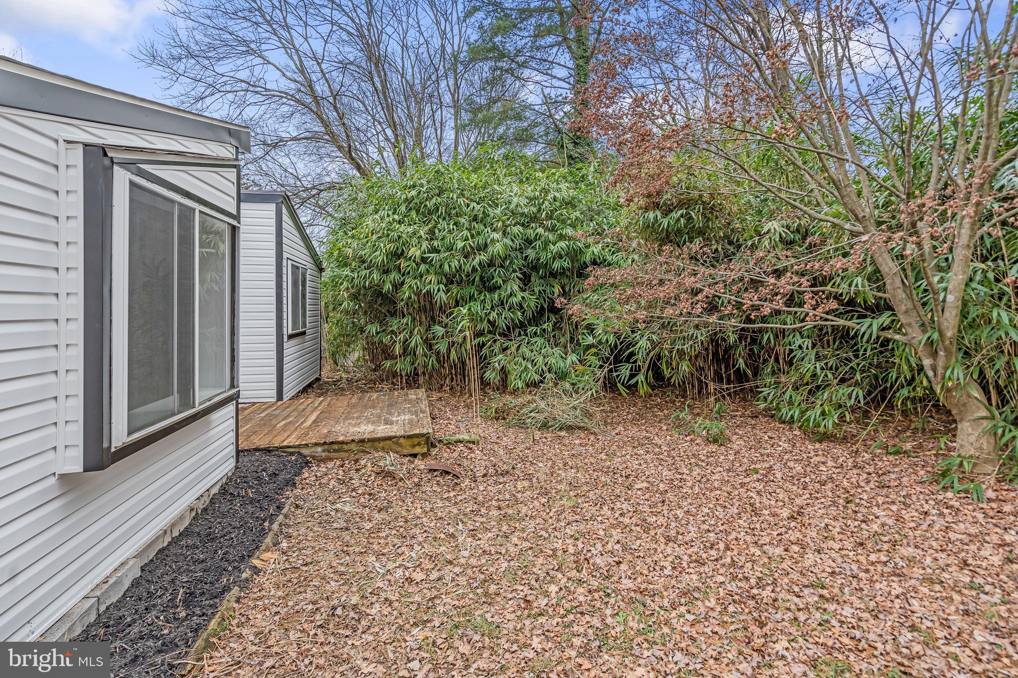 6136 Sinbad Place Columbia, MD 21045 - Photo 30 of 31 a backyard of a house with lots of green space