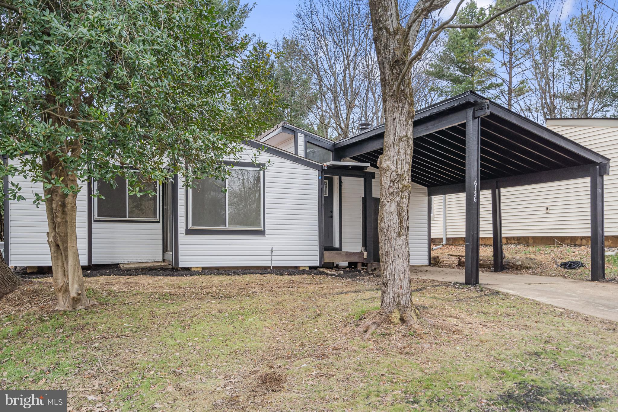 6136 Sinbad Place Columbia, MD 21045 - Photo 7 of 31 a backyard of a house with shaded area
